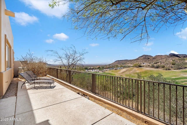 view of patio / terrace featuring a mountain view