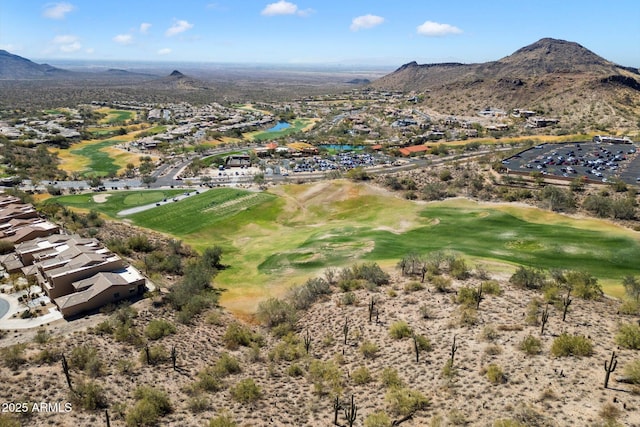 birds eye view of property featuring view of golf course and a mountain view