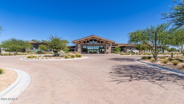 exterior space featuring curved driveway