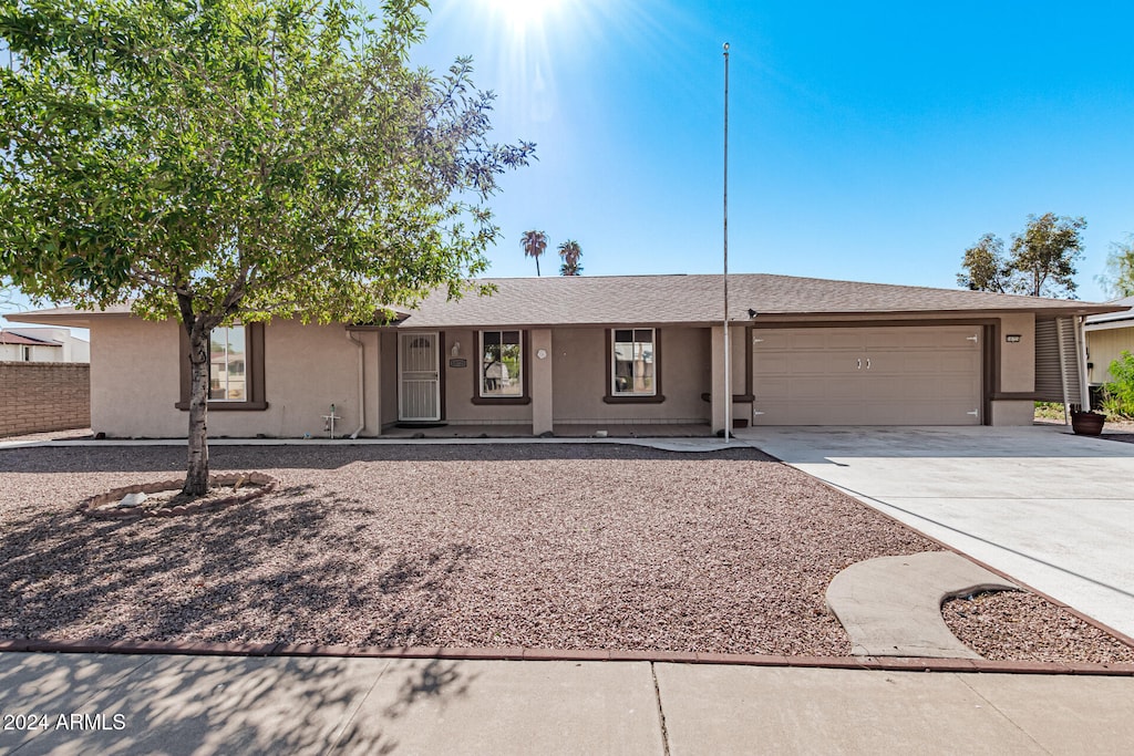 ranch-style home with a garage