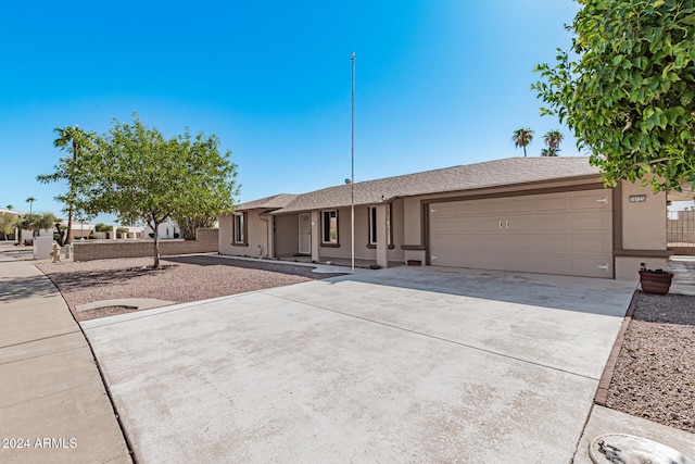 single story home featuring a garage