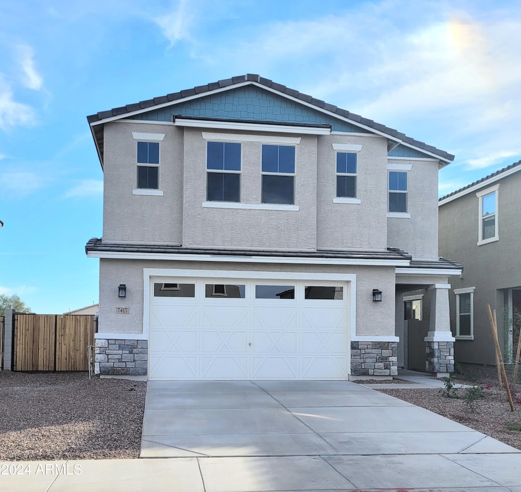 view of front of property with a garage