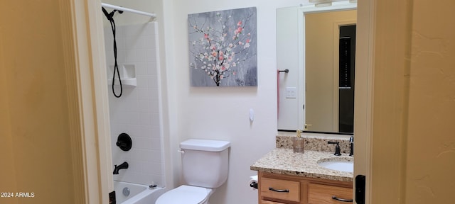 full bathroom featuring bathtub / shower combination, vanity, and toilet