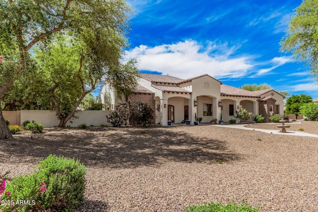 21615 E Pegasus Pkwy, Queen Creek, AZ 85142 - mediterranean / spanish home with stucco siding, a tiled roof, and fence