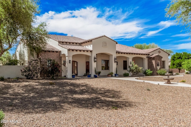 21615 E Pegasus Pkwy, Queen Creek, AZ 85142 - mediterranean / spanish house featuring fence, a tile roof, and stucco siding