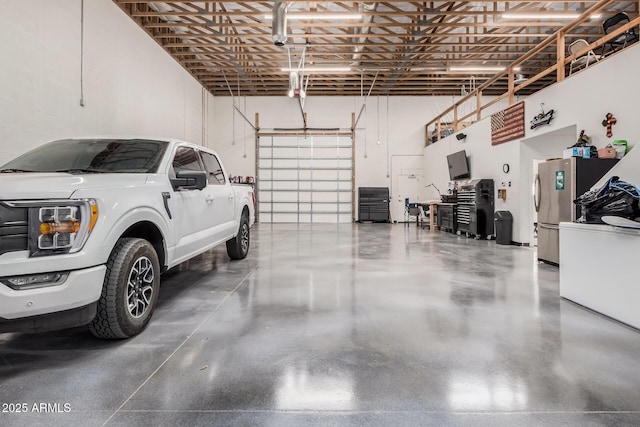 21615 E Pegasus Pkwy, Queen Creek, AZ 85142 - garage with freestanding refrigerator