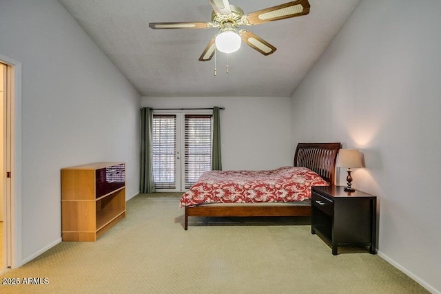 carpeted bedroom featuring ceiling fan and lofted ceiling