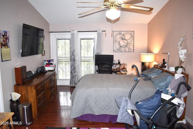 bedroom featuring ceiling fan, lofted ceiling, dark hardwood / wood-style flooring, and multiple windows