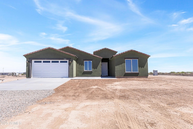 37478 W Hayes St, Tonopah, AZ 85354 - single story home with driveway, an attached garage, stucco siding, and a tile roof