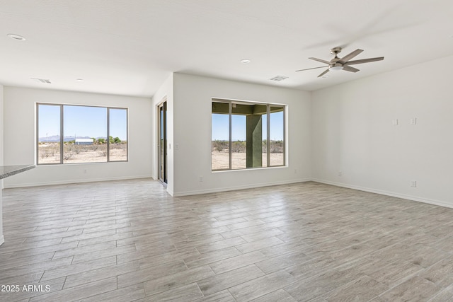 37478 W Hayes St, Tonopah, AZ 85354 - spare room with light wood-style flooring, a ceiling fan, and recessed lighting
