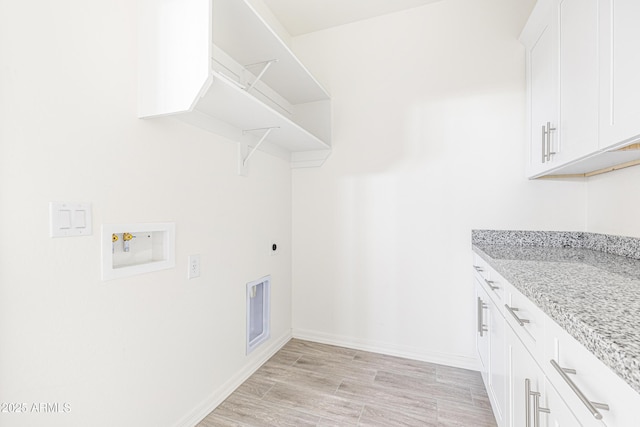 37478 W Hayes St, Tonopah, AZ 85354 - laundry room with hookup for an electric dryer, hookup for a washing machine, cabinet space, and light wood-type flooring