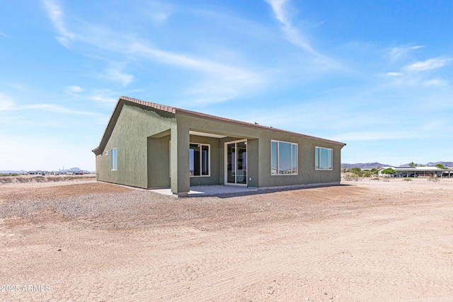 37478 W Hayes St, Tonopah, AZ 85354 - rear view of property with a patio and stucco siding
