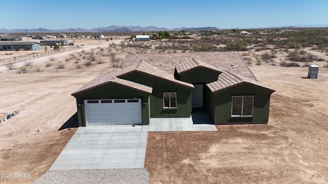 37478 W Hayes St, Tonopah, AZ 85354 - ranch-style house featuring driveway, an attached garage, a mountain view, and view of desert landscape