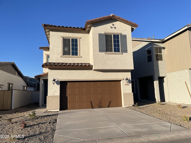 mediterranean / spanish-style home featuring a garage