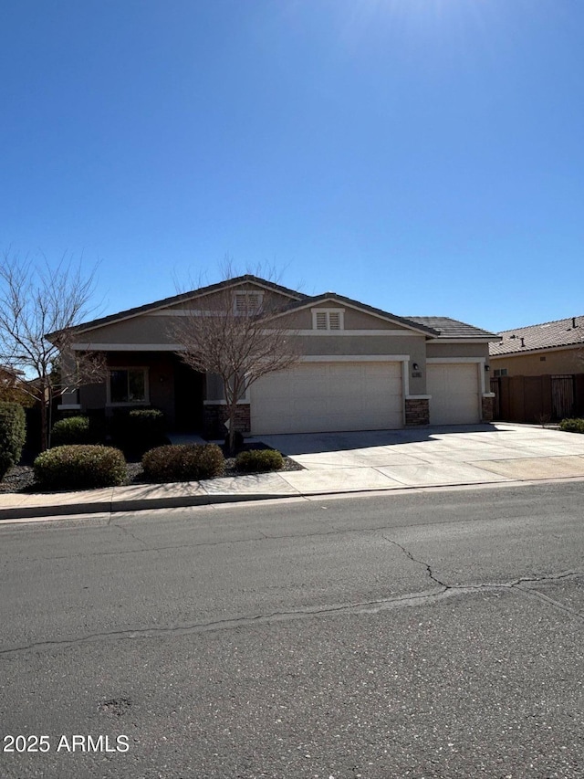 view of front of house with driveway and a garage