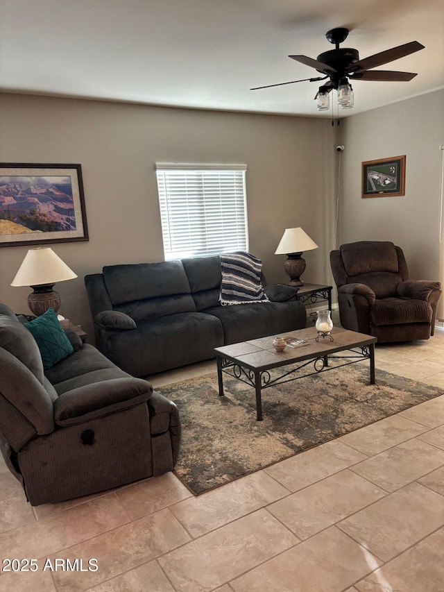 living room featuring light tile patterned floors and ceiling fan