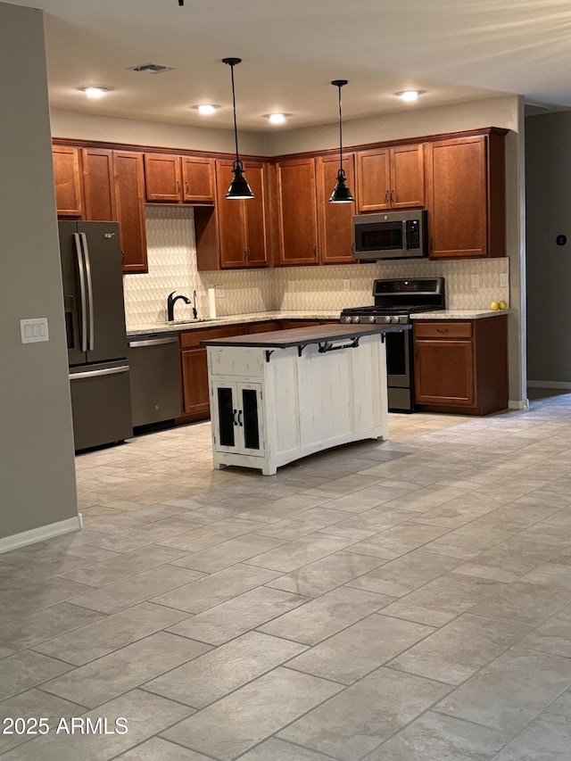 kitchen with hanging light fixtures, decorative backsplash, stainless steel appliances, and a sink