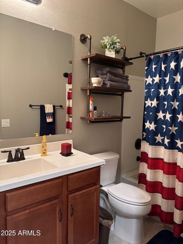 bathroom with toilet and vanity