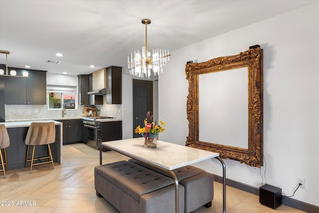 dining room with baseboards, an inviting chandelier, visible vents, and recessed lighting