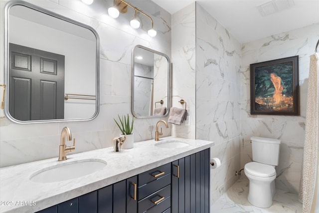 full bath featuring marble finish floor, visible vents, a sink, and toilet