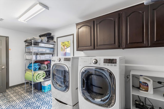 laundry room featuring cabinet space, baseboards, visible vents, tile patterned floors, and washer and dryer