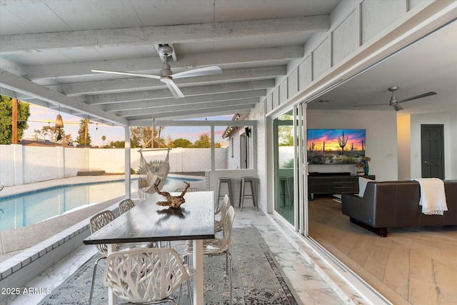 view of pool featuring ceiling fan