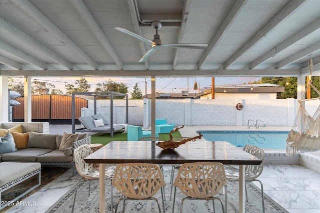 sunroom featuring ceiling fan and beamed ceiling