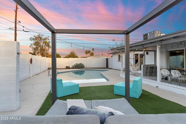 view of swimming pool with a patio area, a fenced backyard, and a fenced in pool