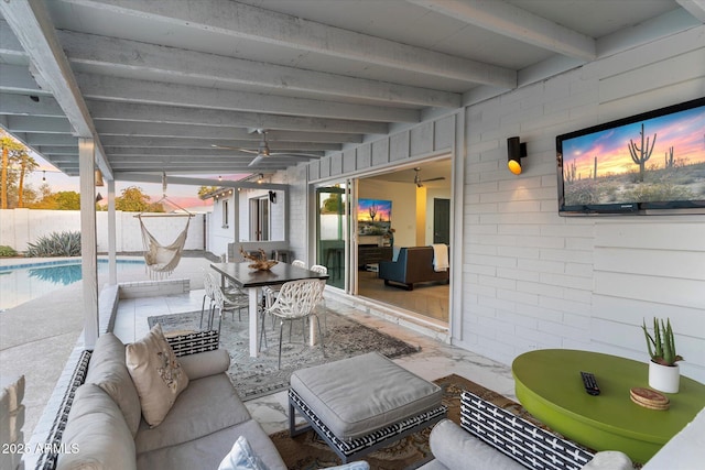 view of patio with ceiling fan, outdoor lounge area, fence, a fenced in pool, and outdoor dining space