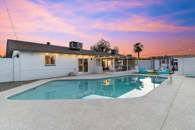 view of pool featuring a fenced in pool, cooling unit, a patio, and fence