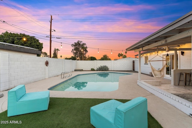 view of pool featuring a fenced in pool, a fenced backyard, and a patio