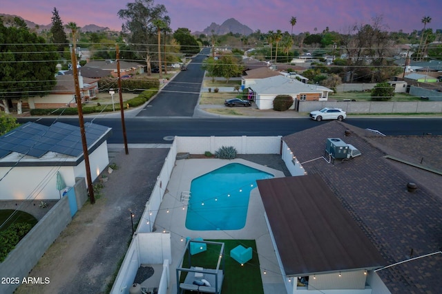 view of swimming pool featuring a fenced backyard