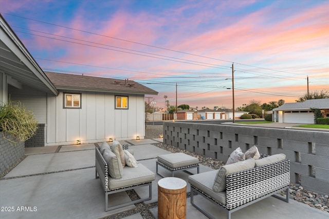 patio terrace at dusk featuring outdoor lounge area