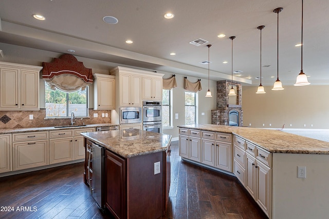 kitchen with dark hardwood / wood-style flooring, decorative light fixtures, and a kitchen island