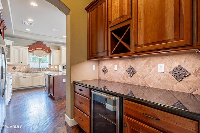 kitchen featuring tasteful backsplash, wine cooler, stone counters, and dark hardwood / wood-style flooring