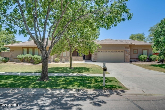 view of front facade with a front lawn and a garage