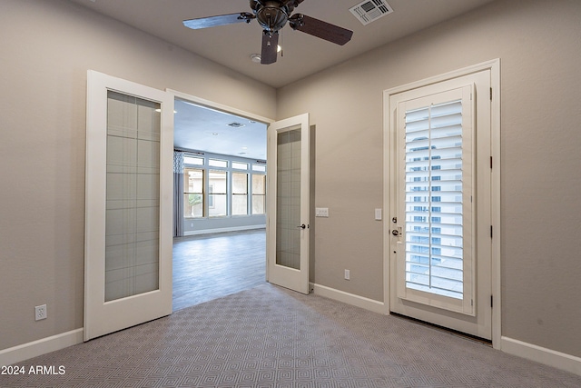 entryway featuring french doors, light hardwood / wood-style flooring, a wealth of natural light, and ceiling fan