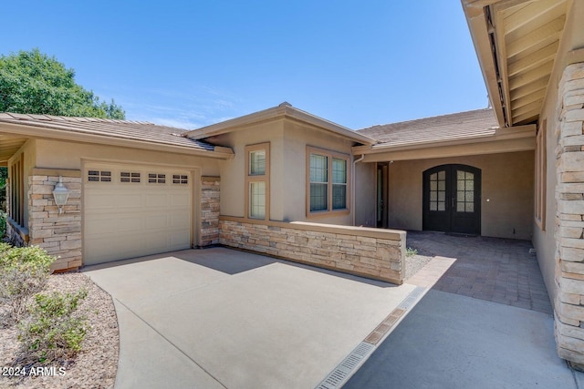 entrance to property featuring a garage