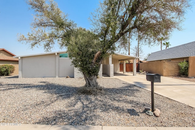 view of front facade with a carport