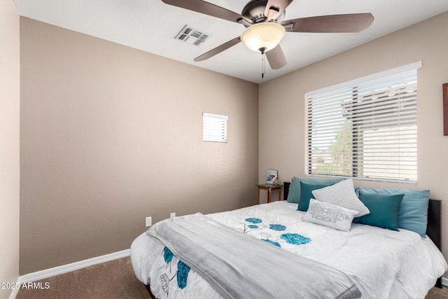 3041 E Fremont Rd, Phoenix, AZ 85042 - carpeted bedroom featuring baseboards and a ceiling fan