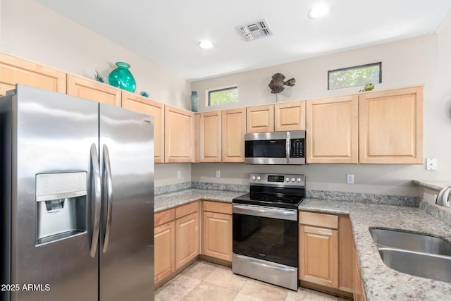 3041 E Fremont Rd, Phoenix, AZ 85042 - kitchen with stainless steel appliances, light brown cabinets, recessed lighting, and light stone counters