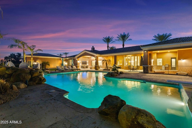 outdoor pool featuring a patio area