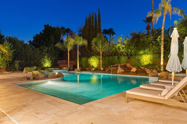 pool featuring a patio area