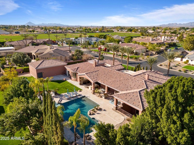 drone / aerial view featuring a residential view and a mountain view