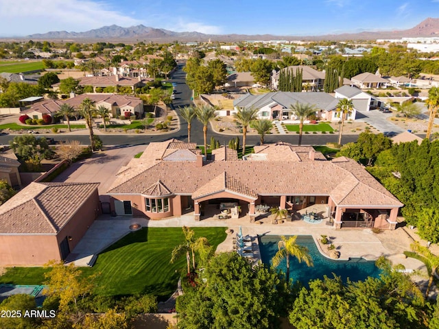 drone / aerial view featuring a residential view and a mountain view