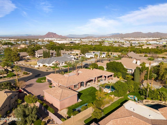 drone / aerial view featuring a residential view and a mountain view