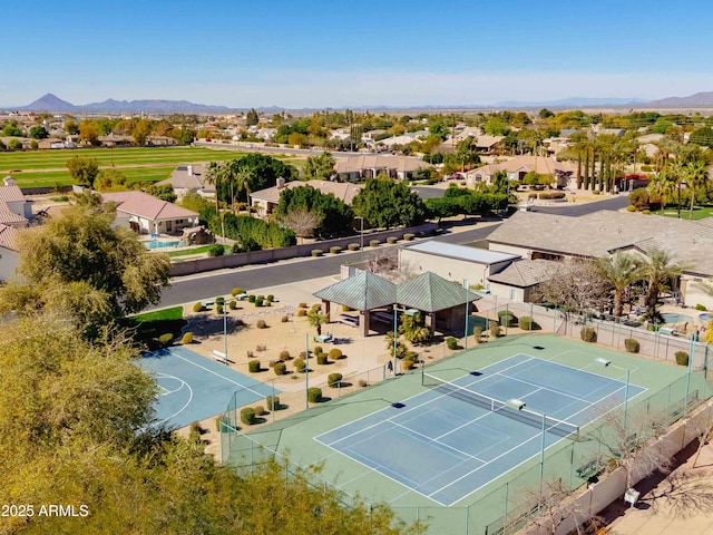 drone / aerial view with a residential view and a mountain view