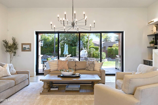 living room with wood finished floors and an inviting chandelier