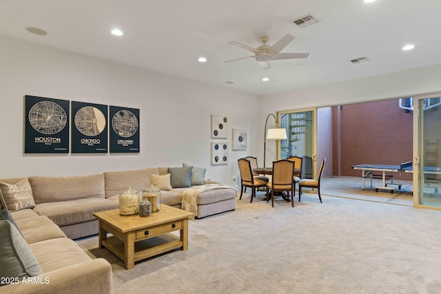 living area with a ceiling fan, visible vents, carpet flooring, and recessed lighting