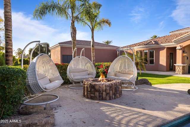 view of patio with a fire pit